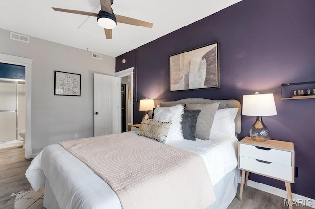 5858 Nina Pl # 1W, Saint Louis, MO 63112 - bedroom with wood finished floors and a ceiling fan