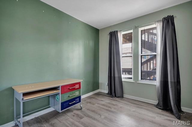 5858 Nina Pl # 1W, Saint Louis, MO 63112 - unfurnished office with wood finished floors and baseboards