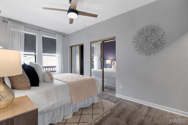 5858 Nina Pl # 1W, Saint Louis, MO 63112 - bedroom with wood finished floors, multiple closets, and ceiling fan