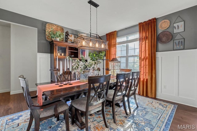144 Wilmer Valley Dr, Wentzville, MO 63385 - dining room with wood finished floors, a wainscoted wall, and a decorative wall