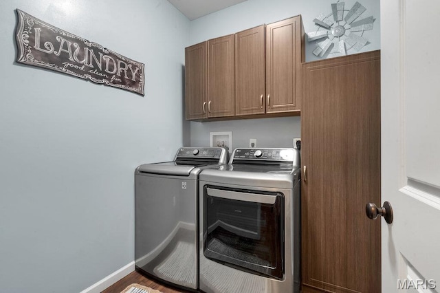 144 Wilmer Valley Dr, Wentzville, MO 63385 - washroom featuring washer and dryer, cabinet space, and wood finished floors