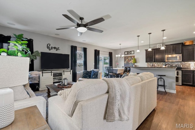 144 Wilmer Valley Dr, Wentzville, MO 63385 - living room featuring ceiling fan, dark wood-type flooring, a chandelier, and recessed lighting