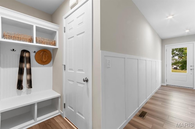 341 Newbridge Way, Ofallon, MO 63368 - mudroom with wood finished floors and a wainscoted wall