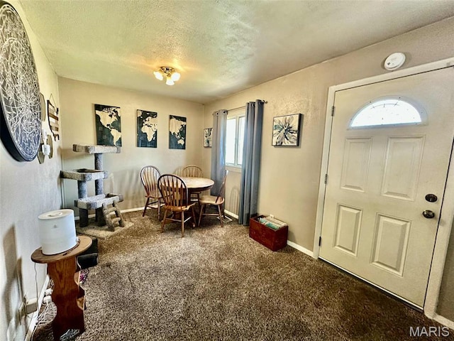 116 Charlene St, East Alton, IL 62024 - carpeted dining space featuring a textured ceiling and baseboards