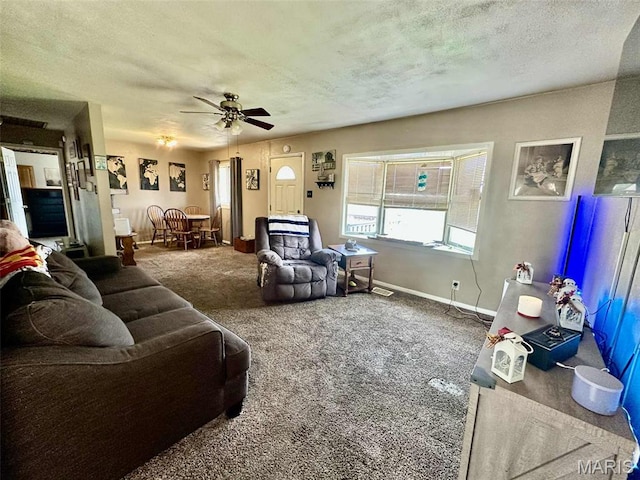 116 Charlene St, East Alton, IL 62024 - carpeted living room featuring ceiling fan, a textured ceiling, and baseboards