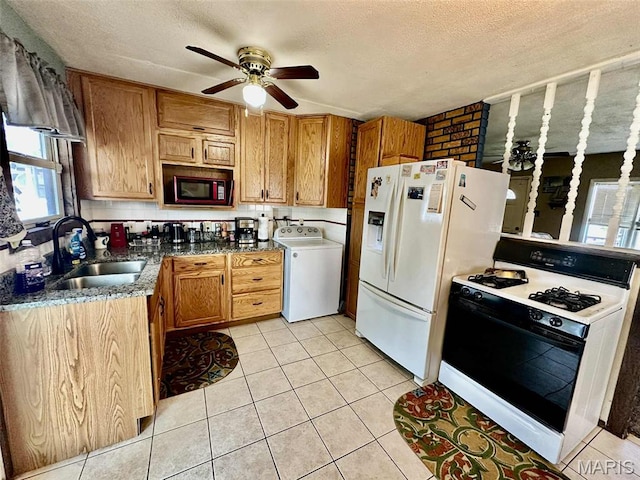 116 Charlene St, East Alton, IL 62024 - kitchen with washer / dryer, gas stove, a sink, white fridge with ice dispenser, and a ceiling fan