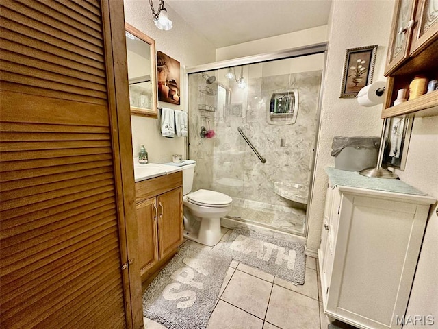 116 Charlene St, East Alton, IL 62024 - bathroom featuring toilet, a shower stall, vanity, and tile patterned flooring