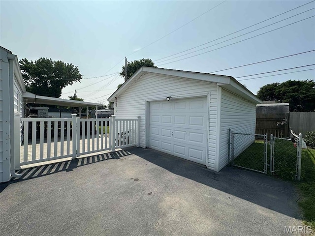 116 Charlene St, East Alton, IL 62024 - detached garage with driveway and a gate