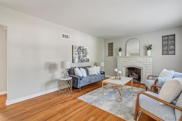 657 Lilac Ave, Webster Groves, MO 63119 - living area featuring wood finished floors and a fireplace