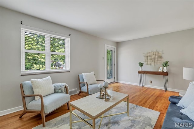 657 Lilac Ave, Webster Groves, MO 63119 - living area with baseboards and wood finished floors