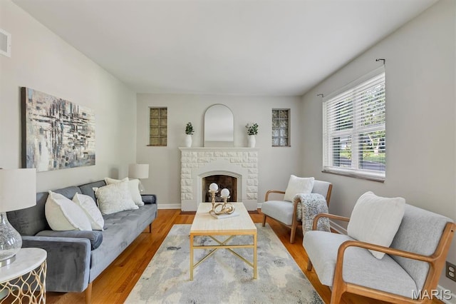 657 Lilac Ave, Webster Groves, MO 63119 - living area with a fireplace and wood finished floors