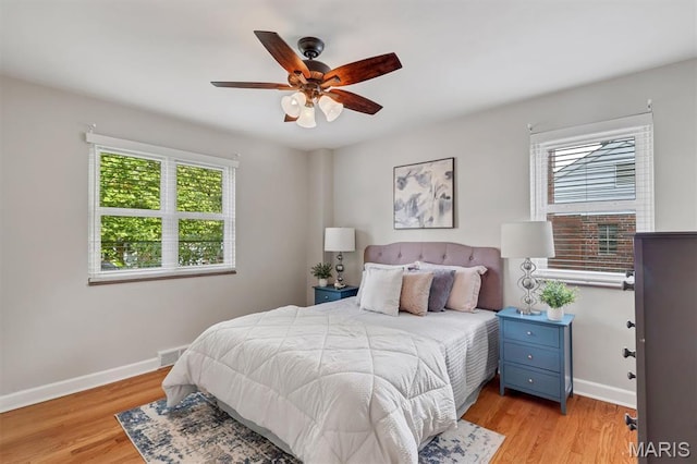 657 Lilac Ave, Webster Groves, MO 63119 - bedroom with light wood-style floors and a ceiling fan