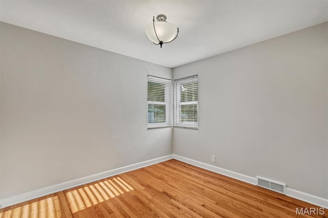 657 Lilac Ave, Webster Groves, MO 63119 - spare room with baseboards and light wood finished floors