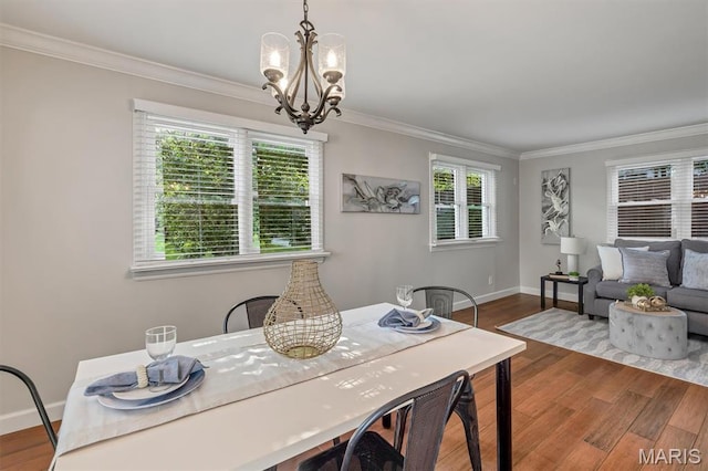 657 Lilac Ave, Webster Groves, MO 63119 - dining area with a chandelier, crown molding, and wood finished floors