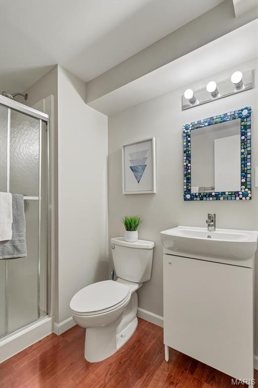 657 Lilac Ave, Webster Groves, MO 63119 - full bath with vanity, wood finished floors, and a stall shower