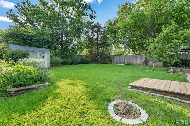 657 Lilac Ave, Webster Groves, MO 63119 - fenced backyard with a wooden deck and a storage shed