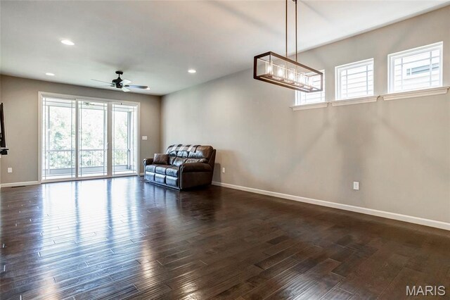 2216 Cournier St, Saint Charles, MO 63301 - living area with dark wood-type flooring, recessed lighting, a chandelier, and ceiling fan