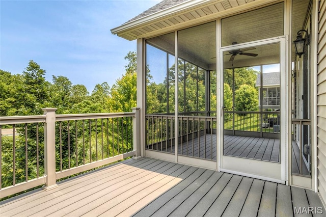 2216 Cournier St, Saint Charles, MO 63301 - wooden terrace featuring view of wooded area and a ceiling fan