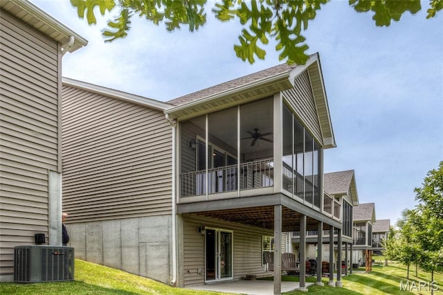 2216 Cournier St, Saint Charles, MO 63301 - rear view of property with a sunroom, ceiling fan, a yard, and a patio