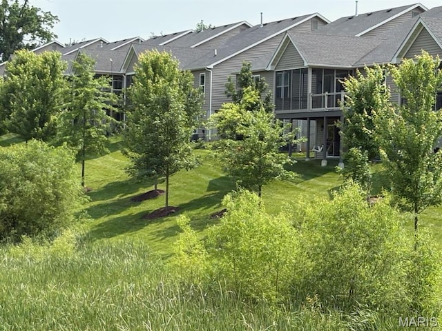 2216 Cournier St, Saint Charles, MO 63301 - view of grassy yard featuring a sunroom