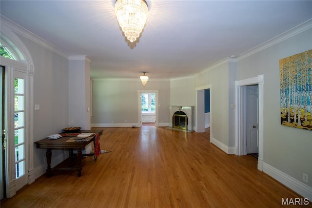 37 Joy Ave, Webster Groves, MO 63119 - living area featuring a chandelier, light wood-style floors, crown molding, and a fireplace with flush hearth
