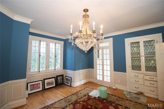 37 Joy Ave, Webster Groves, MO 63119 - dining area featuring a chandelier, wainscoting, wood finished floors, and crown molding