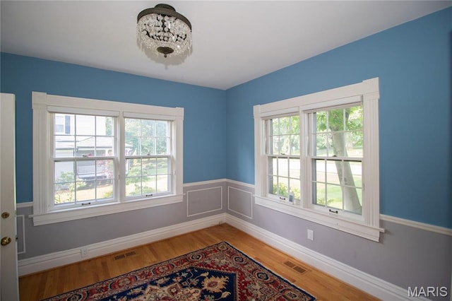 37 Joy Ave, Webster Groves, MO 63119 - unfurnished room featuring healthy amount of natural light and light wood-style floors
