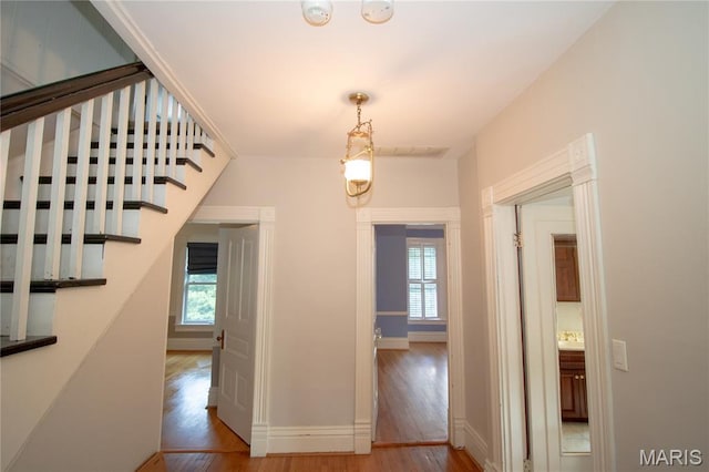 37 Joy Ave, Webster Groves, MO 63119 - hallway with wood finished floors and stairway