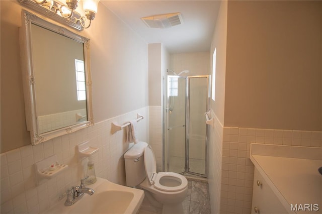 37 Joy Ave, Webster Groves, MO 63119 - full bathroom with tile walls, a shower stall, wainscoting, and tile patterned floors