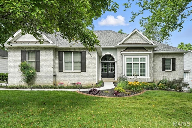 17 Eagles Way Ln, Lake St Louis, MO 63367 - single story home with a front yard, brick siding, and roof with shingles