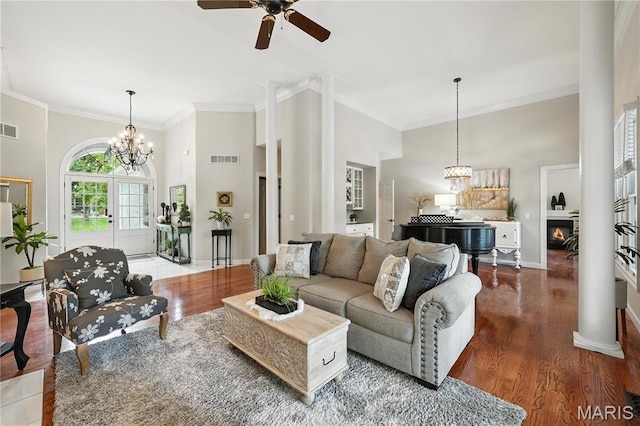 17 Eagles Way Ln, Lake St Louis, MO 63367 - living area with ceiling fan, wood finished floors, crown molding, a chandelier, and a high ceiling