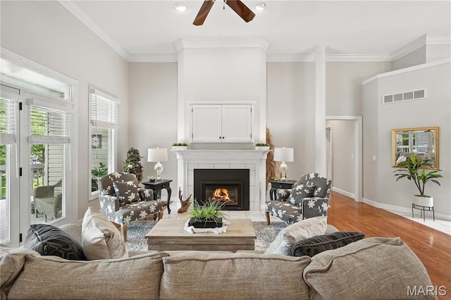 17 Eagles Way Ln, Lake St Louis, MO 63367 - living area with a ceiling fan, a tile fireplace, ornamental molding, wood finished floors, and recessed lighting