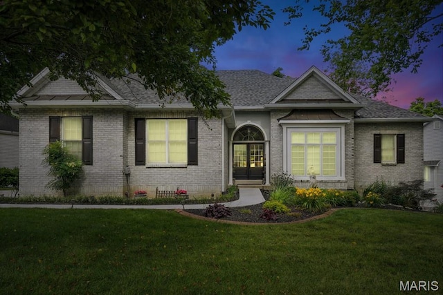 17 Eagles Way Ln, Lake St Louis, MO 63367 - ranch-style home with a lawn, roof with shingles, and brick siding