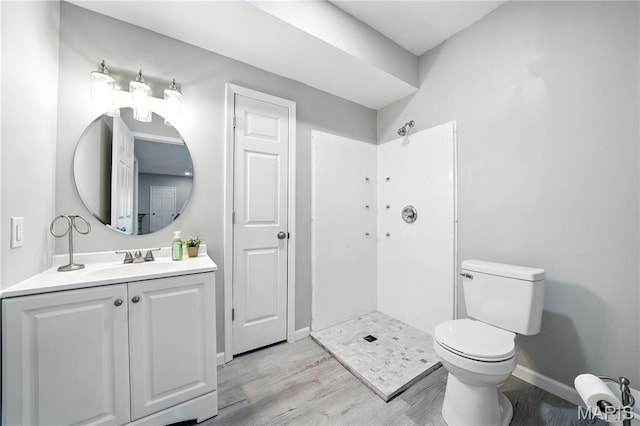 17 Eagles Way Ln, Lake St Louis, MO 63367 - bathroom featuring wood finished floors, vanity, and a shower
