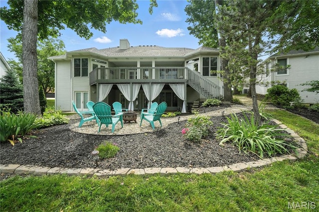 17 Eagles Way Ln, Lake St Louis, MO 63367 - back of property featuring a fire pit, a wooden deck, stairs, french doors, and a chimney