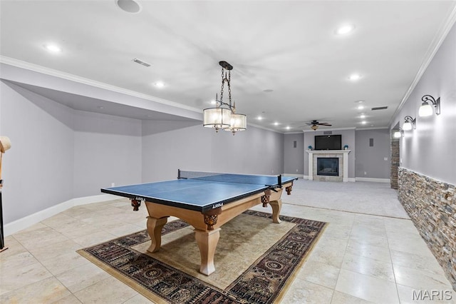3046 Beaver Creek Cpe, Girardeau, MO 63701 - rec room with crown molding, a fireplace, a ceiling fan, recessed lighting, and light tile patterned flooring