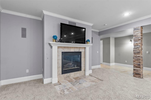 3046 Beaver Creek Cpe, Girardeau, MO 63701 - unfurnished living room with ornamental molding, a tiled fireplace, carpet flooring, and ornate columns