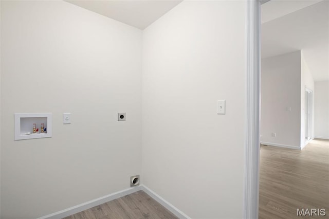 1720 Martingale Ln, Eureka, MO 63025 - laundry room featuring hookup for an electric dryer, hookup for a washing machine, light wood-style flooring, and baseboards