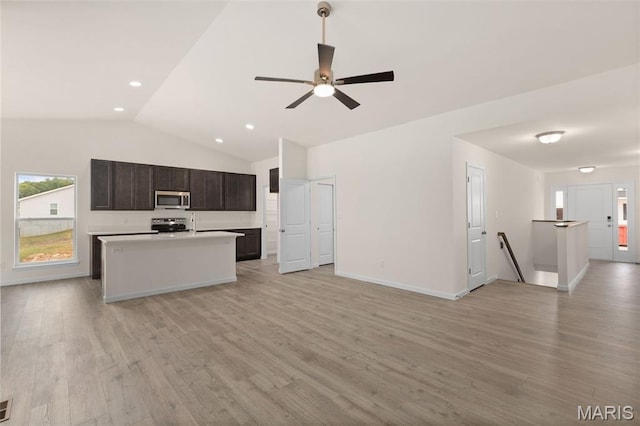 1720 Martingale Ln, Eureka, MO 63025 - kitchen with stainless steel appliances, open floor plan, an island with sink, healthy amount of natural light, and lofted ceiling