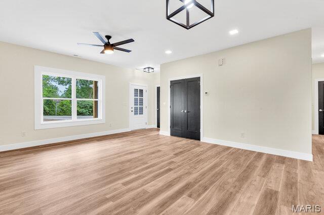 410 Roosevelt, Warrenton, MO 63383 - unfurnished room with light wood finished floors, a ceiling fan, and recessed lighting