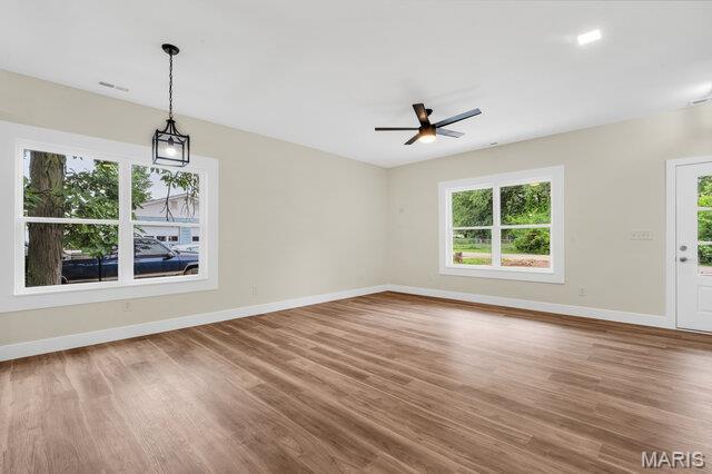 410 Roosevelt, Warrenton, MO 63383 - unfurnished room featuring wood finished floors and ceiling fan