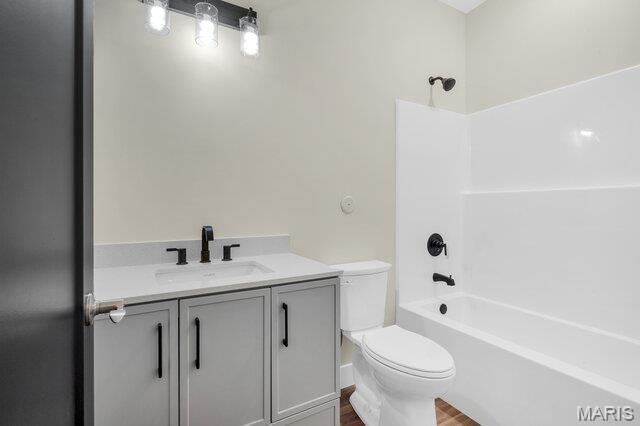 410 Roosevelt, Warrenton, MO 63383 - full bathroom featuring shower / bathtub combination, wood finished floors, and vanity
