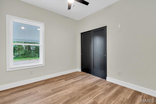 410 Roosevelt, Warrenton, MO 63383 - unfurnished bedroom featuring light wood-type flooring and ceiling fan