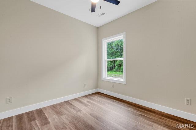 410 Roosevelt, Warrenton, MO 63383 - unfurnished room with ceiling fan and light wood-style flooring