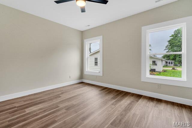 410 Roosevelt, Warrenton, MO 63383 - unfurnished room with wood finished floors and ceiling fan
