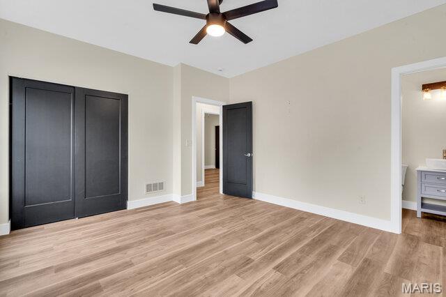 410 Roosevelt, Warrenton, MO 63383 - unfurnished bedroom with light wood-style flooring and ceiling fan