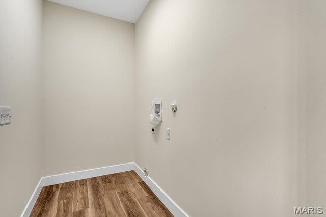 410 Roosevelt, Warrenton, MO 63383 - laundry room featuring hookup for a gas dryer, washer hookup, and wood finished floors