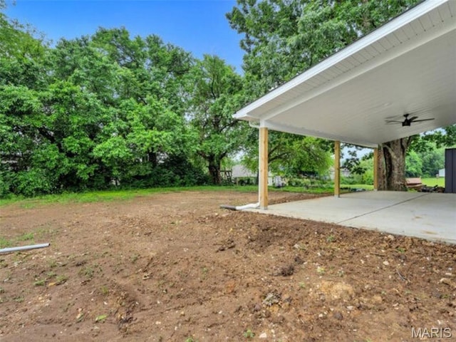 410 Roosevelt, Warrenton, MO 63383 - view of yard featuring a ceiling fan, a patio area, and view of wooded area