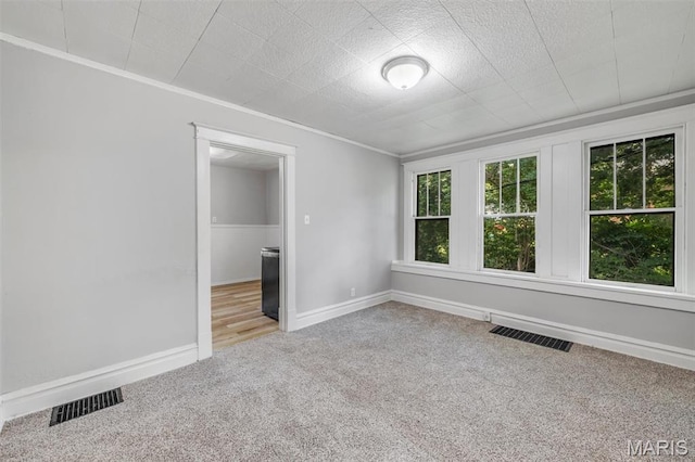 1323 Fairview Ave, University City, MO 63130 - empty room featuring carpet floors, ornamental molding, and baseboards