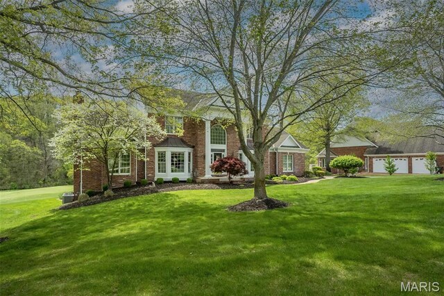 1417 Wheatfield Ln, Saint Albans, MO 63073 - view of front of home with a front lawn and brick siding
